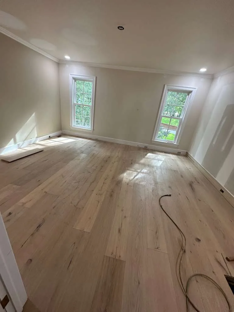 Large room with light laminate just installed