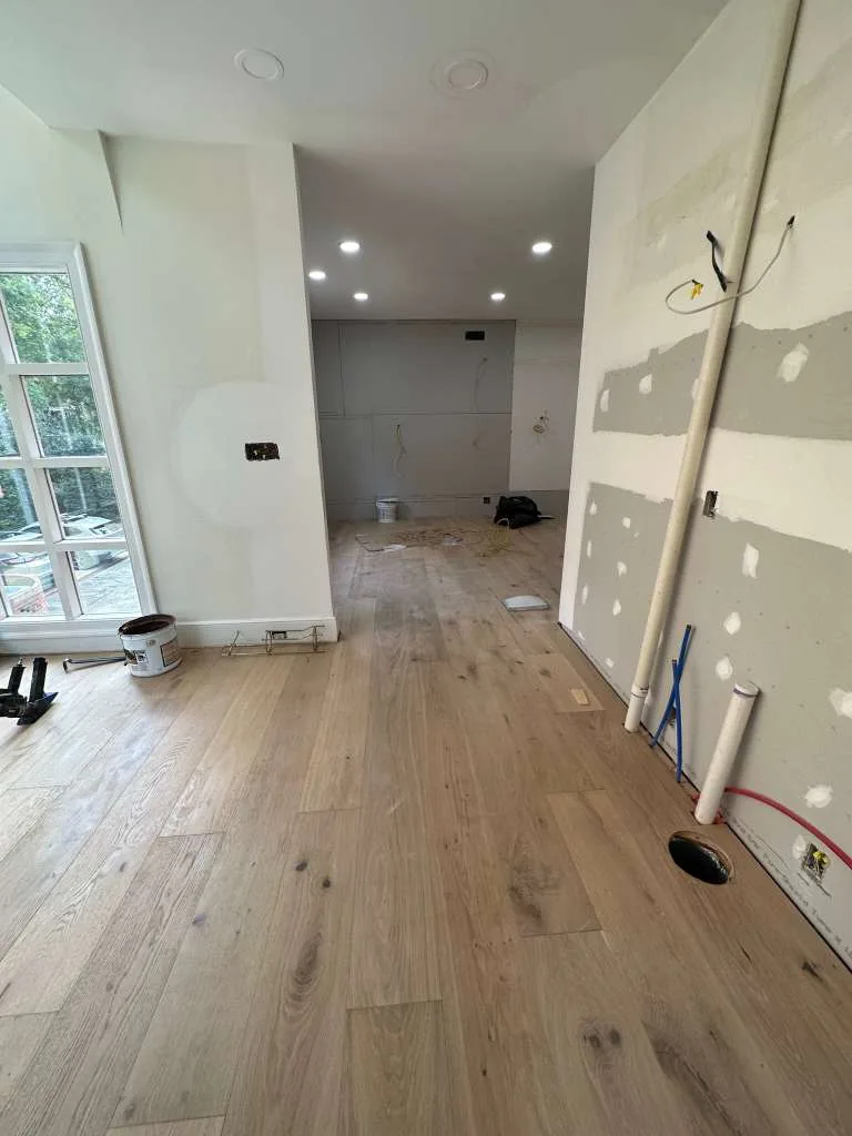 Light laminate flooring in a renovated room