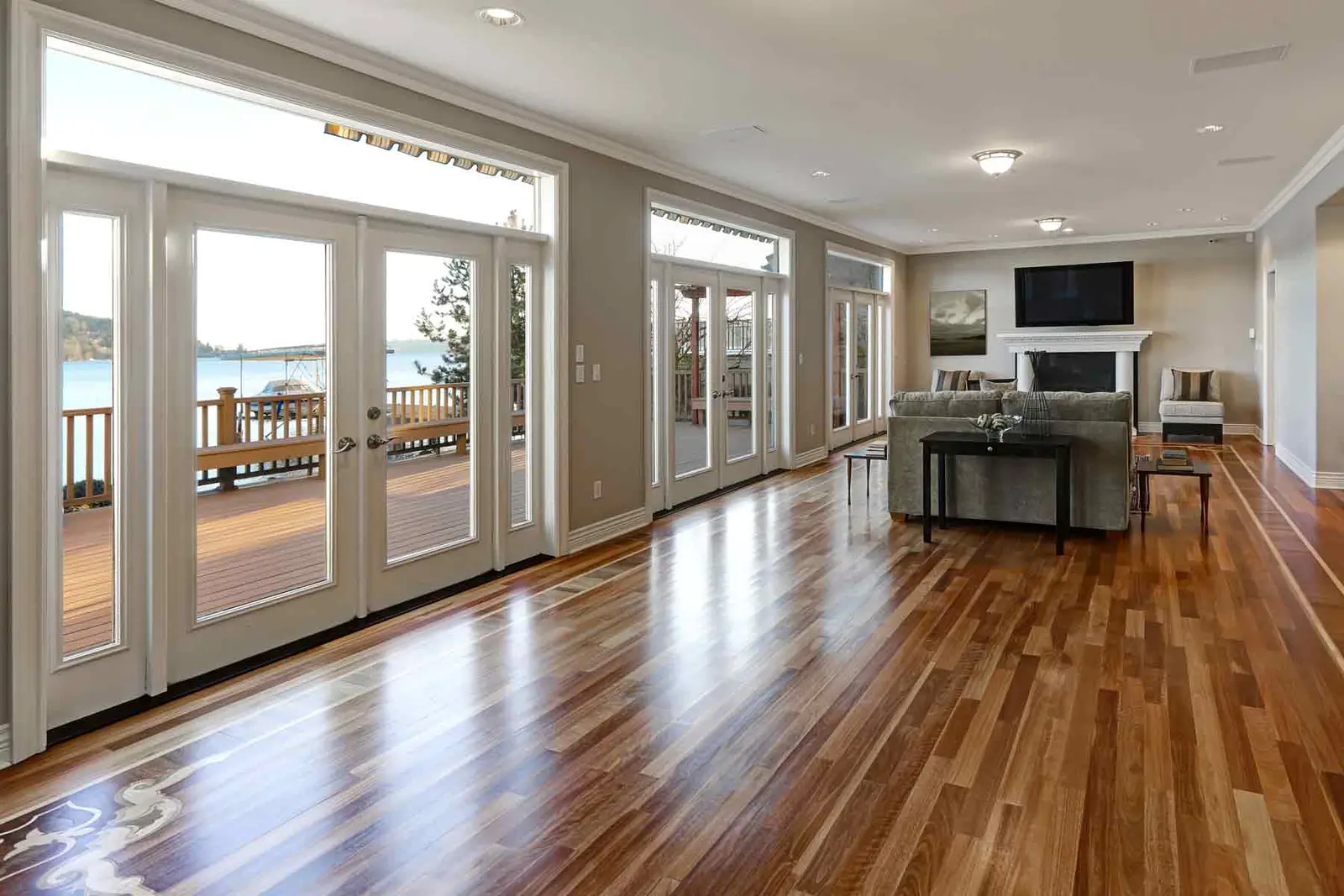Craftsman carefully installing quality plank flooring